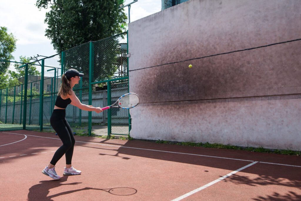 Woman doing Wall Ball Reaction Catch
